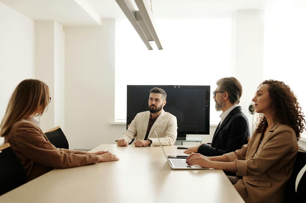 Business professionals gathered around a meeting table