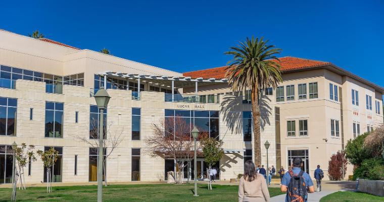Graduate students walking into Lucas Hall, home of Santa Clara's Leavey School of Business