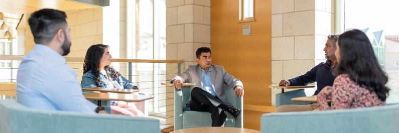 A diverse group of Leavey students networking with each other and faculty