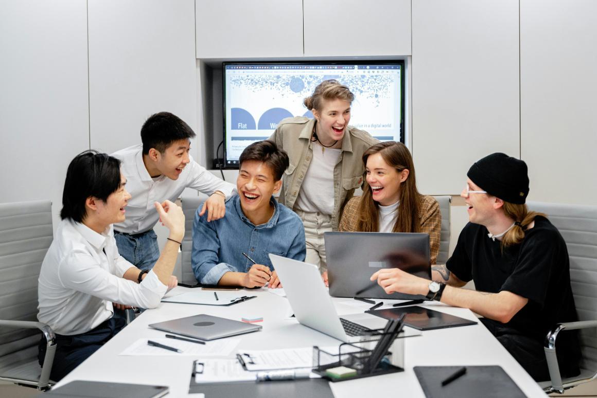 Business colleagues laughing in conference room