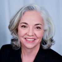A woman smiling in a professional headshot.