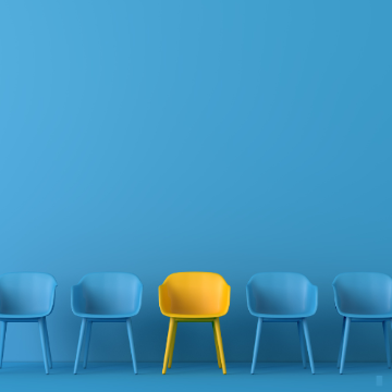 Image of blue chairs and one yellow chair