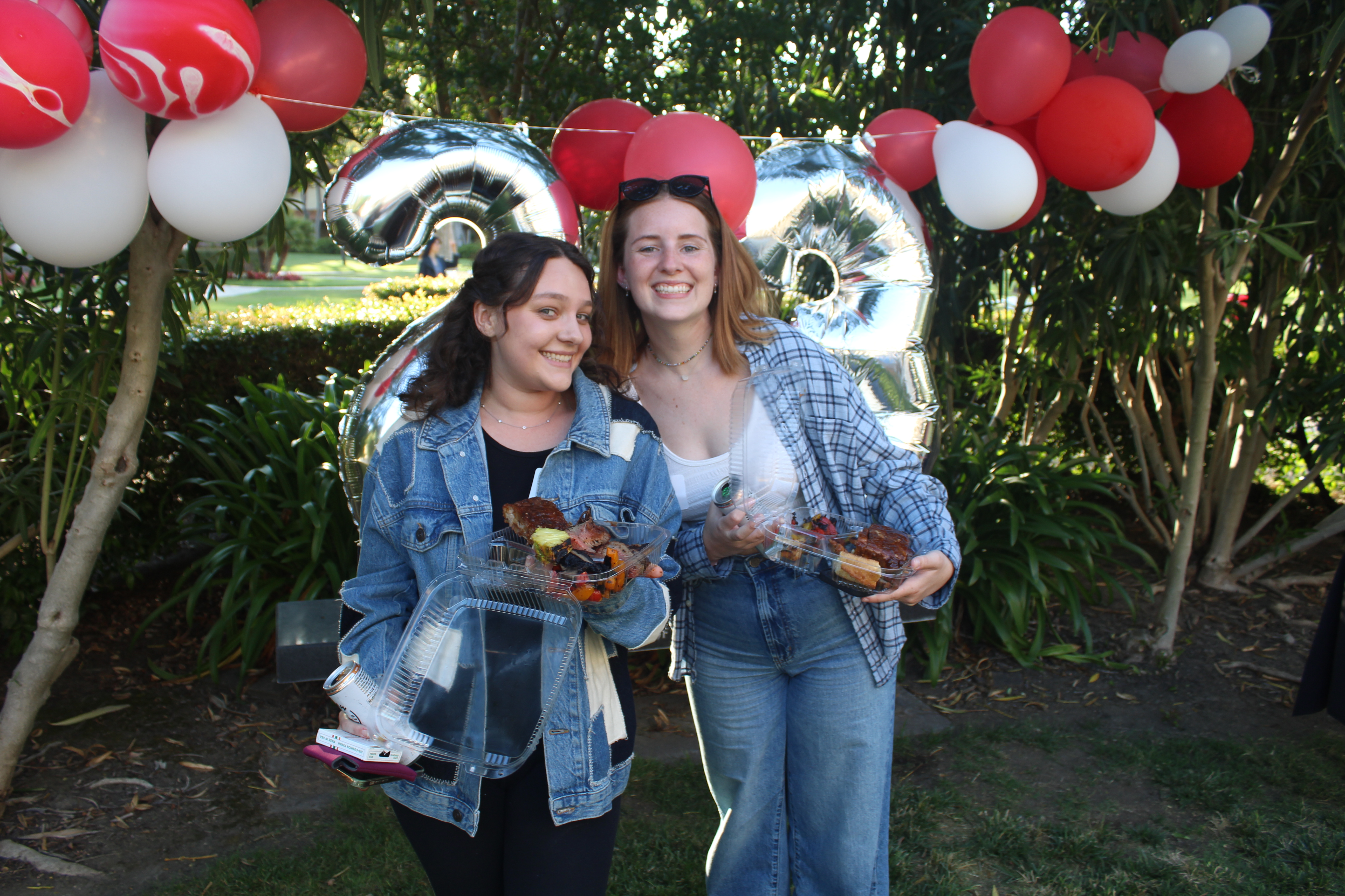 Two girls smiling at BBQ
