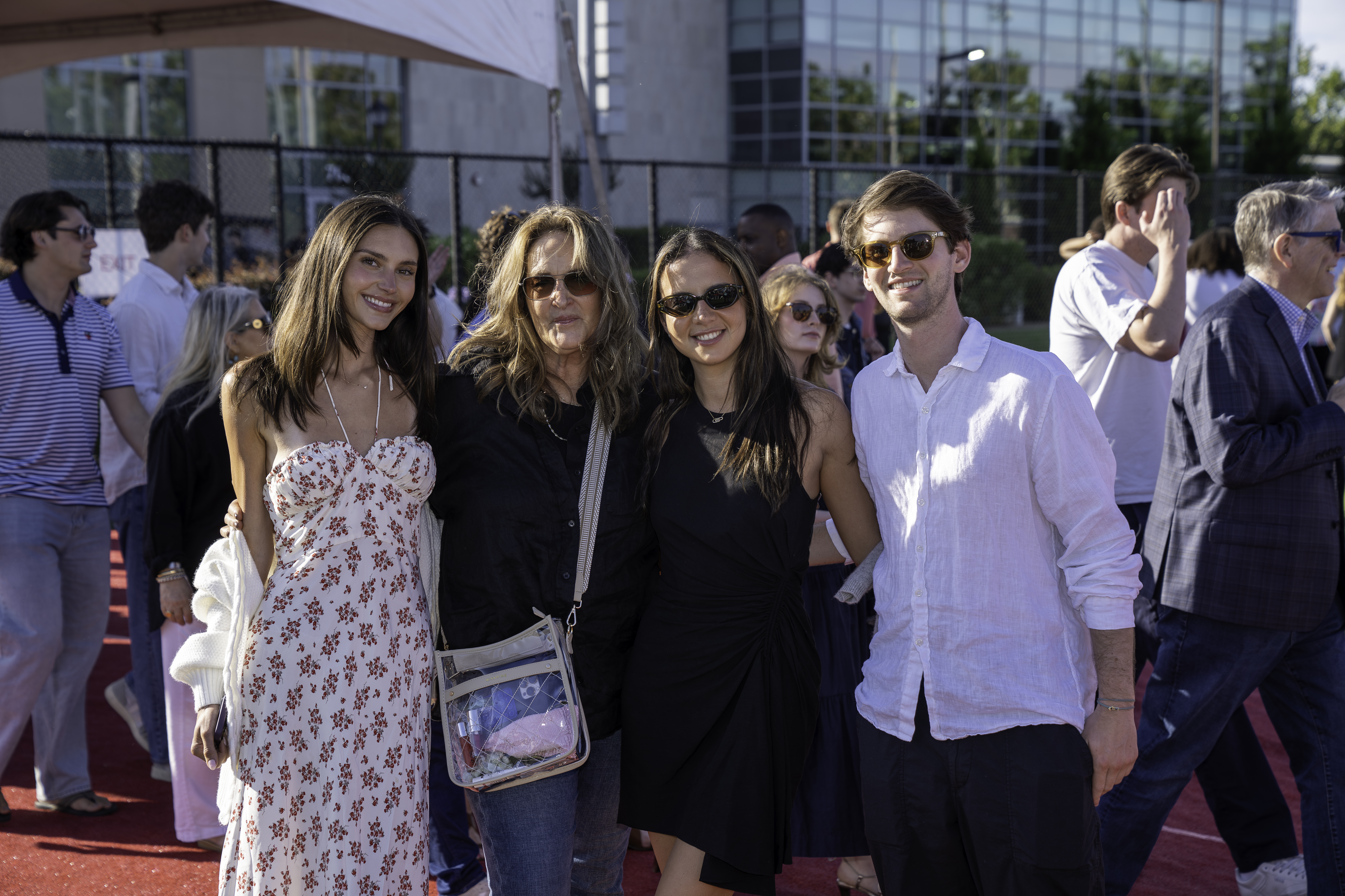 Alumni smiling with family 