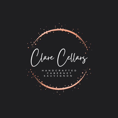 The words Clare Cellars | Handcrafted Cabernet Sauvignon sit in the center of a bronze circle surrounded by decorative bubbles 