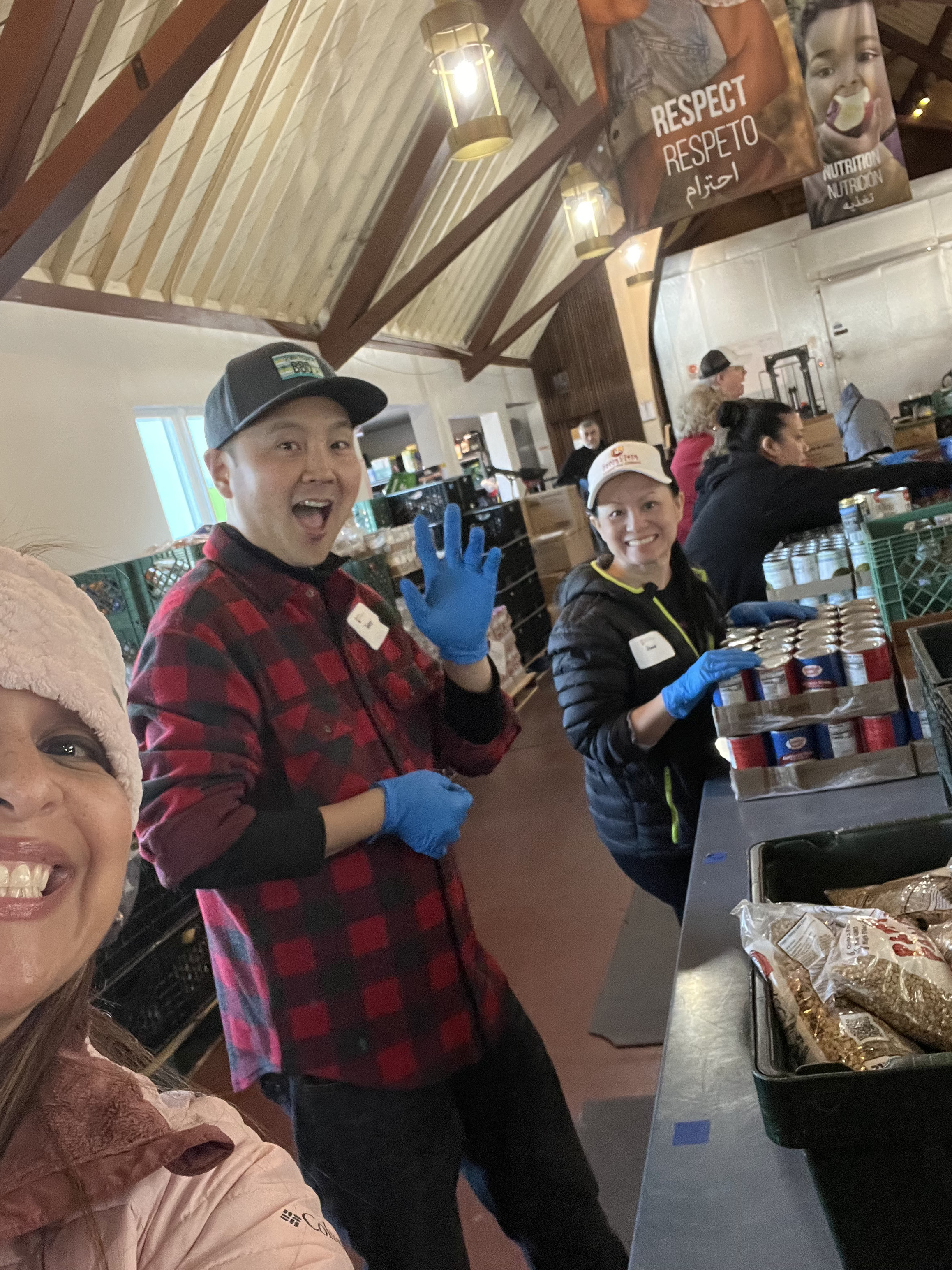 Alumni waving to the camera