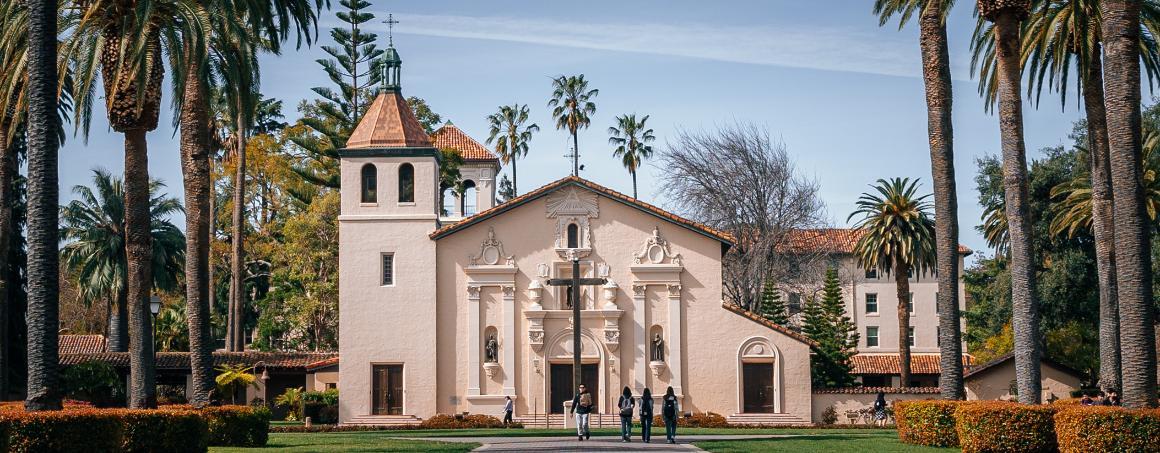 Several students walking in front of Santa Clara de Asís