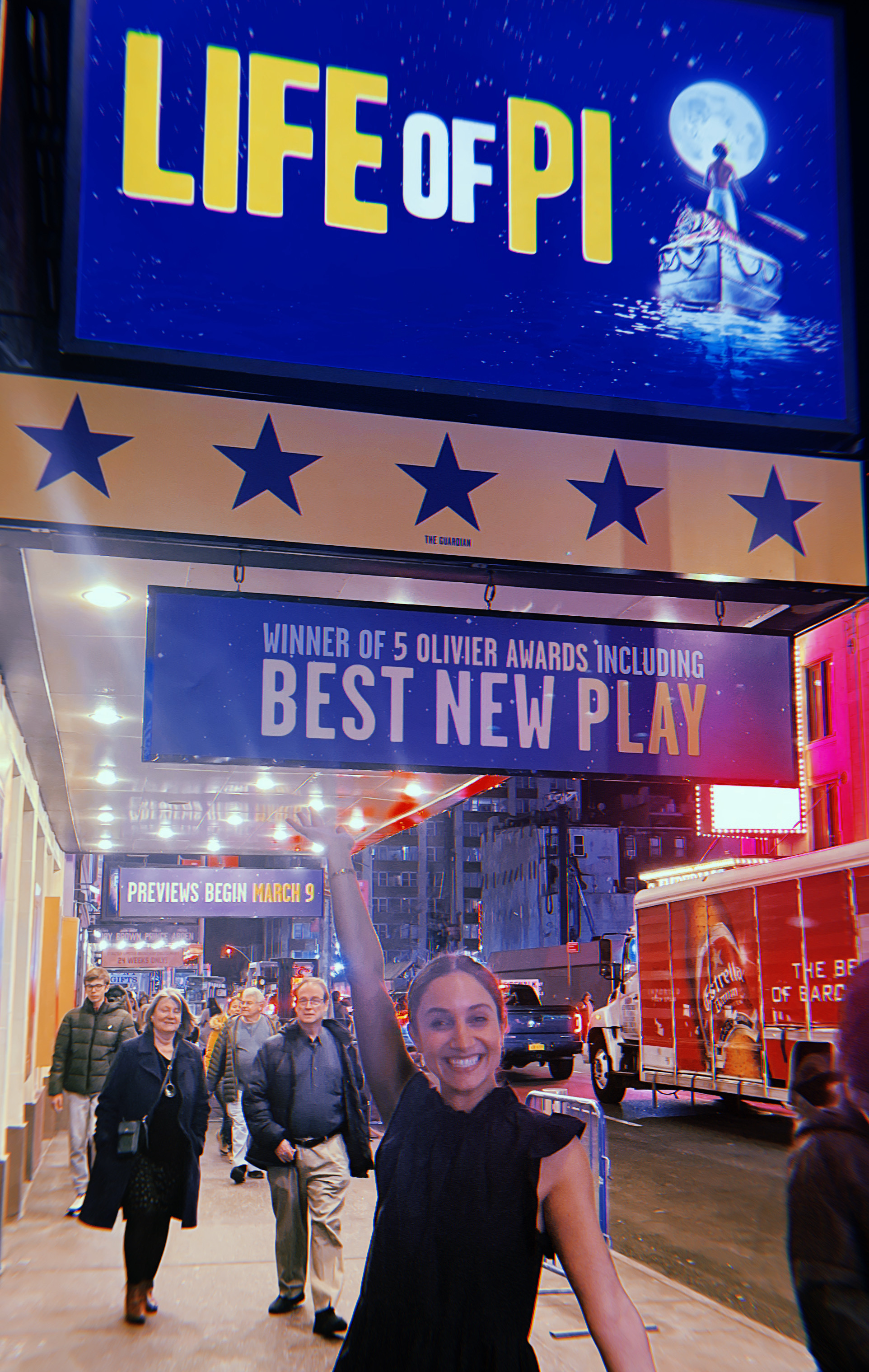 Sonya standing under the marquee for Life of Pi, Feb. 2023