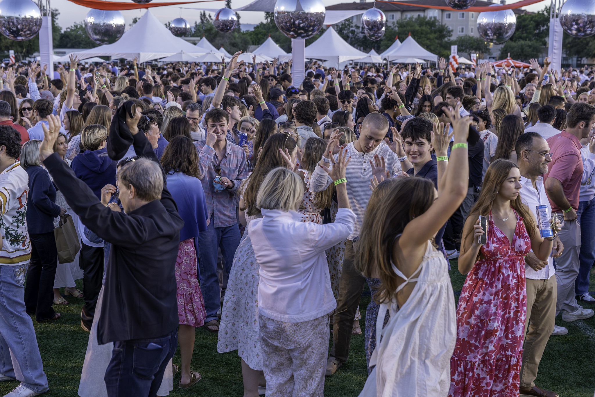 A large group of people celebrating and dancing 