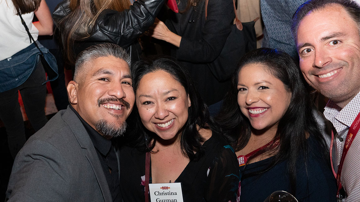 Four people taking a selfie on the dance floor 