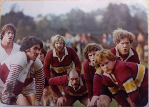 A group of rugby players preparing for a scrum. Hut Rob Adams '79.