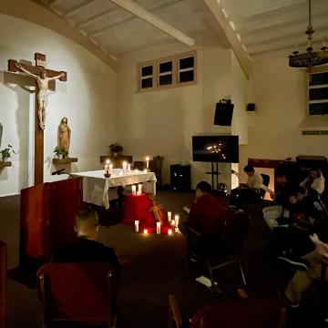 Teach Me How to Pray Retreat Chapel students praying near alter 