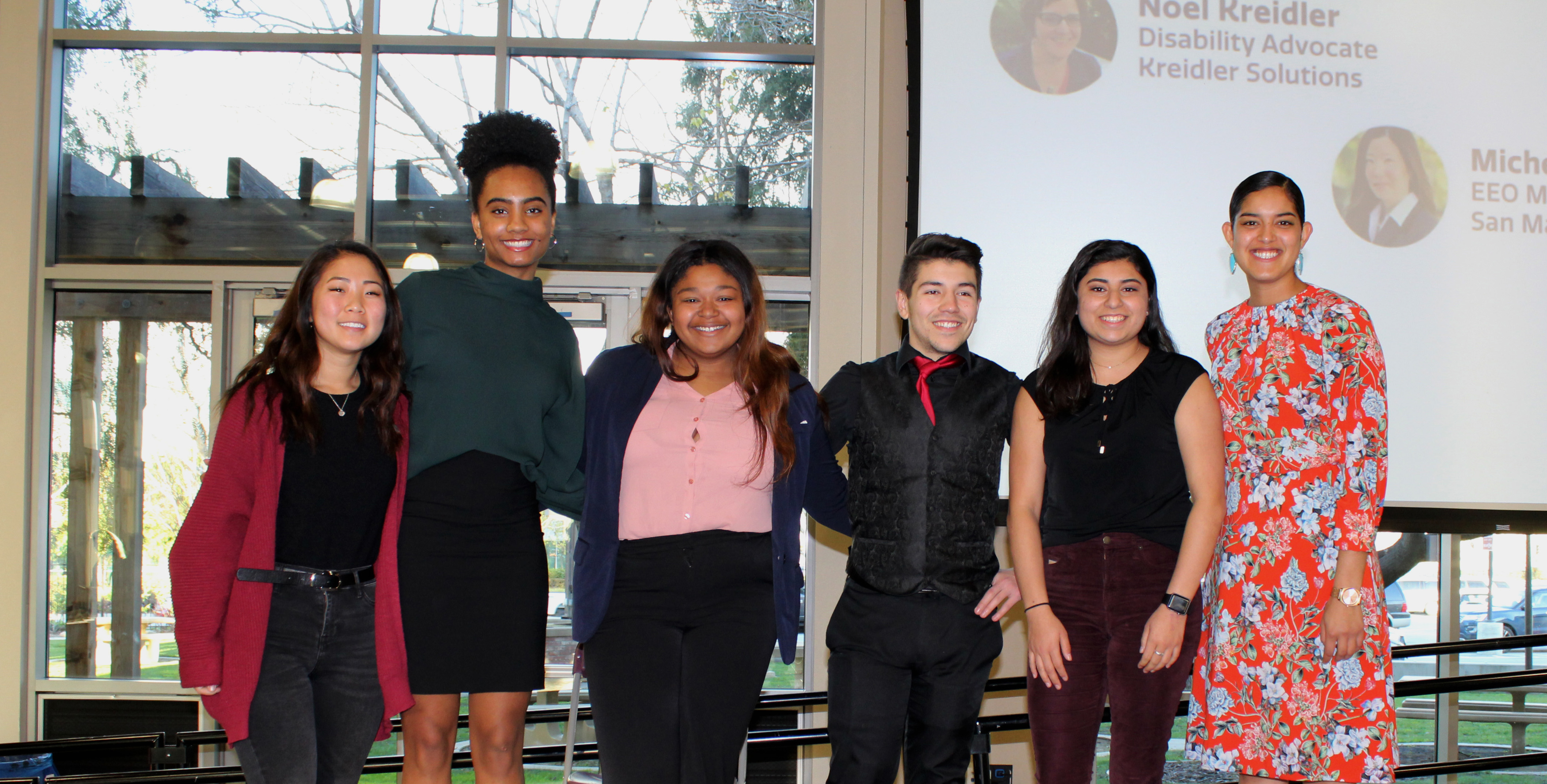 Group of six people in front of 'Diversity Works 2019 Winners' banner.