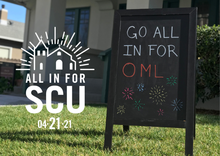 All in for SCU sign beside a chalkboard reading GO ALL IN FOR OML.