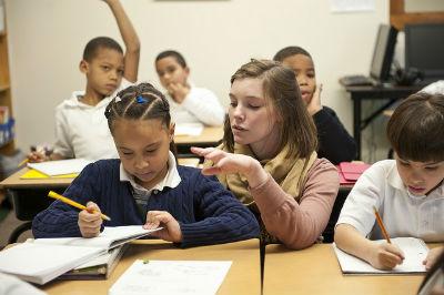 Students in a classroom actively engaged in learning and discussion.