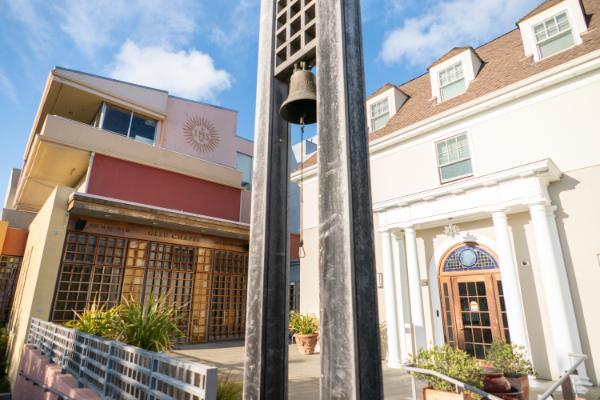 Photo of bell outside IHS building