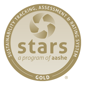 Gold-colored STARS program logo by AASHE with text COMPREHENSIVE. TRANSPARENT. ACCESSIBLE. AASHE GOLD.
