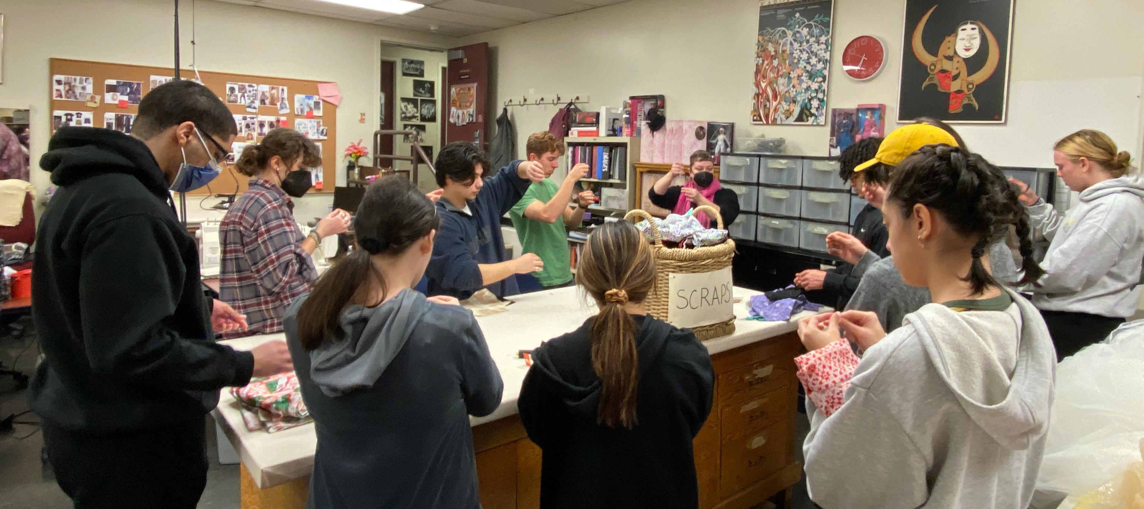 Students learning to sew