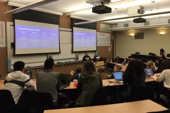 People listening to a presentation in a classroom