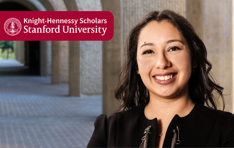 A woman standing in front of an arched hallway image link to story