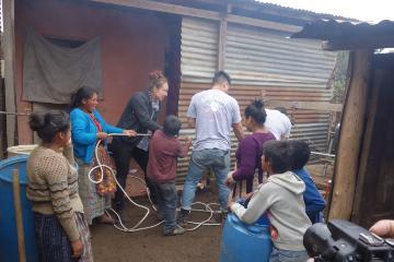 Nine international individuals working together. 