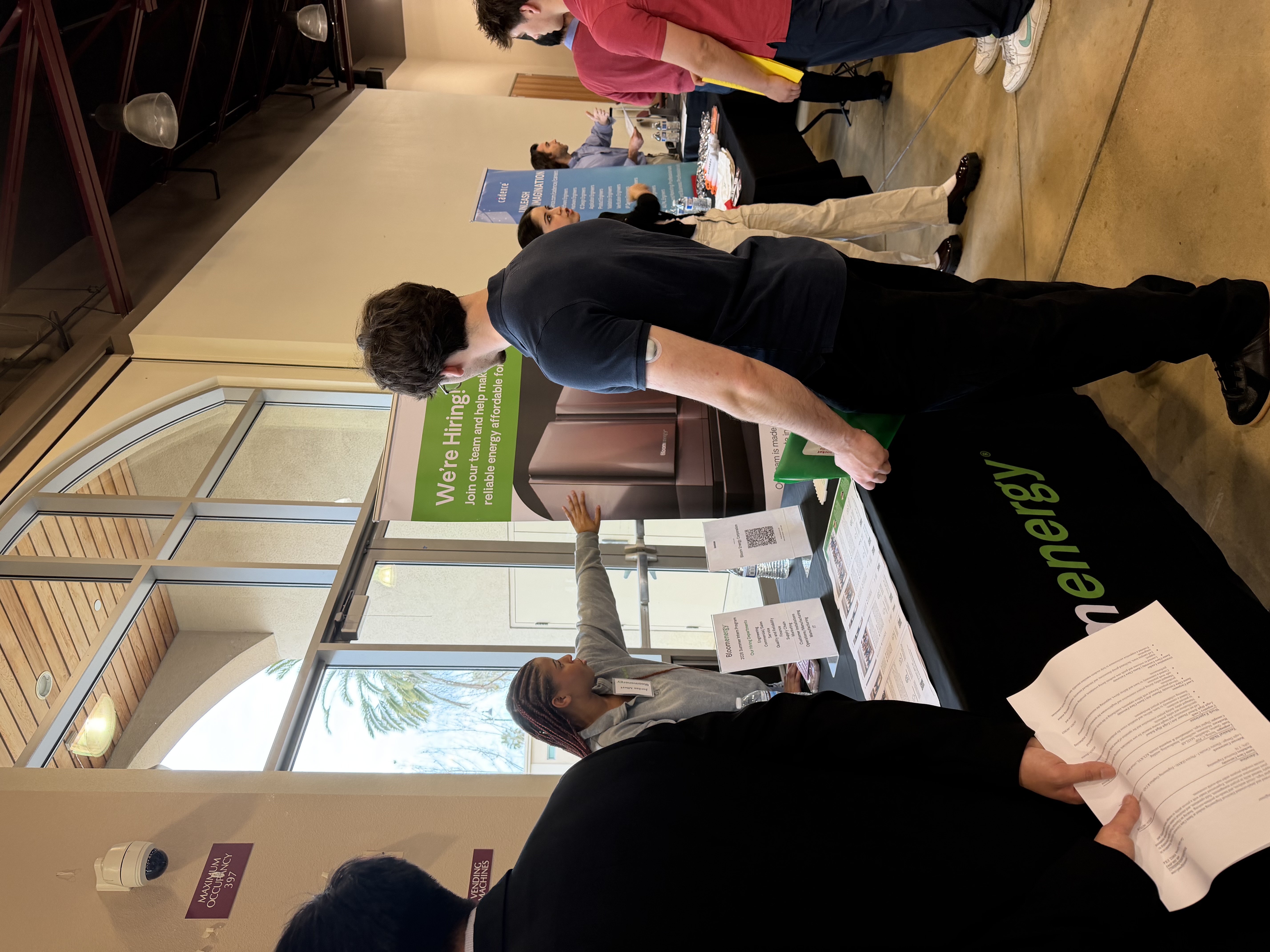 Students speak with representatives from BloomEnergy.