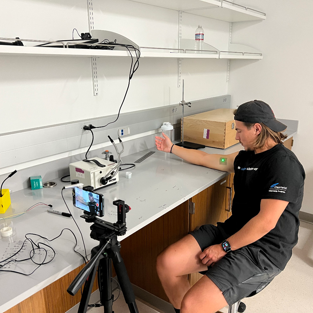 A person working with electronic equipment in a lab.