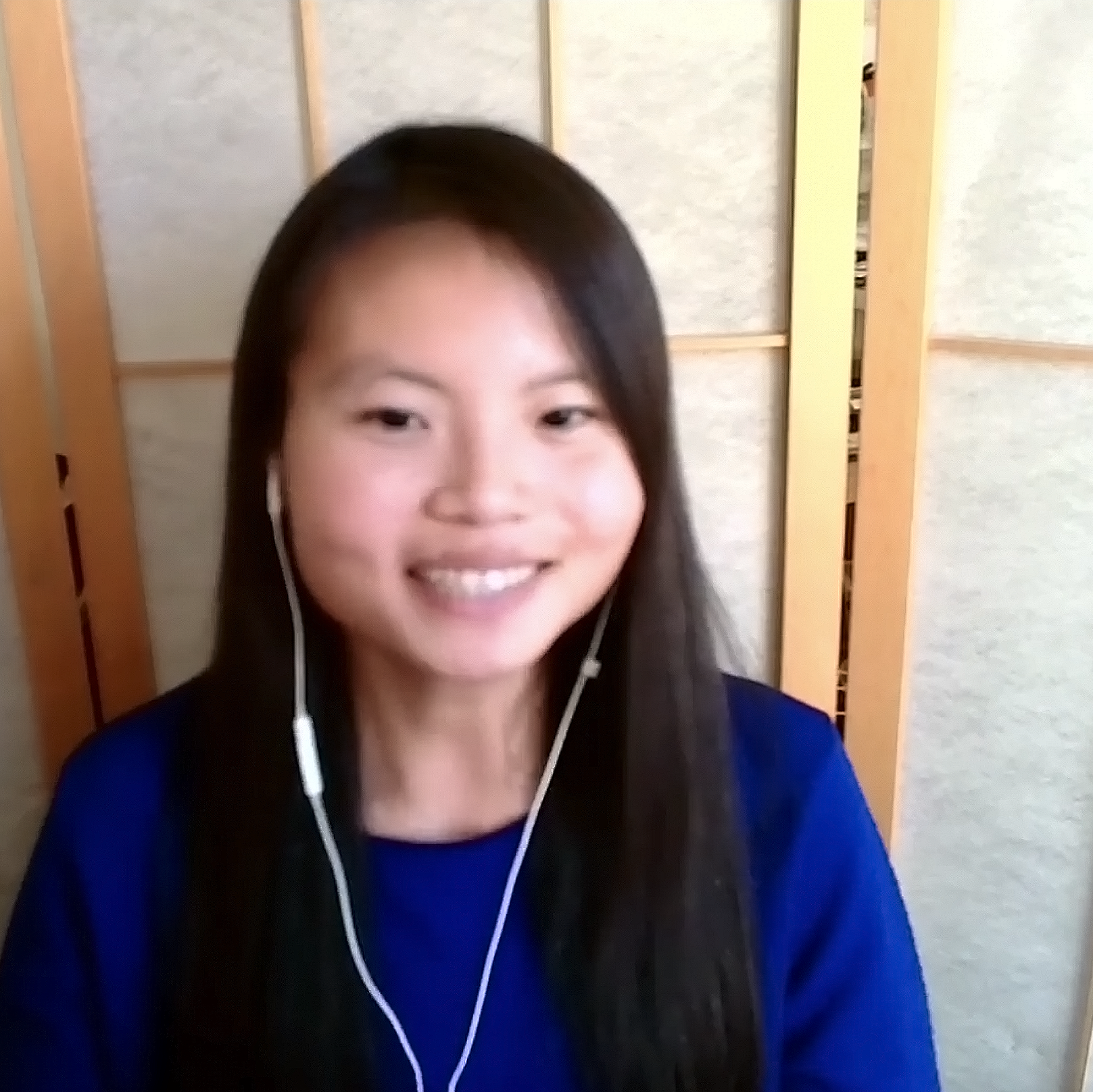 Grace Ling smiling with earphones, at Adobe Max.
