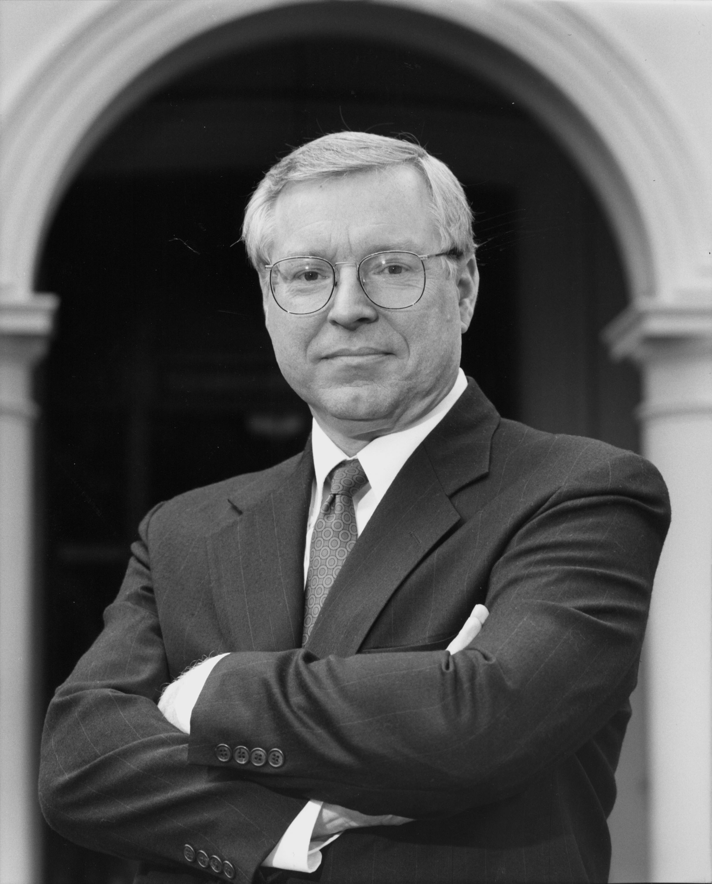 BW portrait of man in a suit titled Terry Shoup.