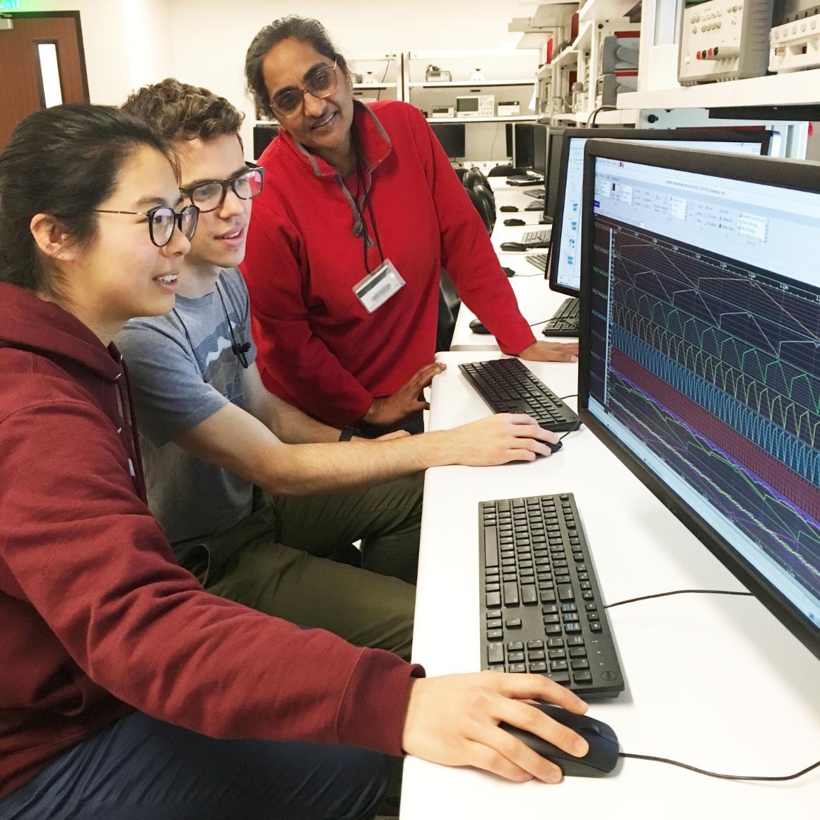 Electrical Engineering Chair and Professor Shoba Krishnan with Anne Hsia and Bradford Kidd in an electrical engineering lab