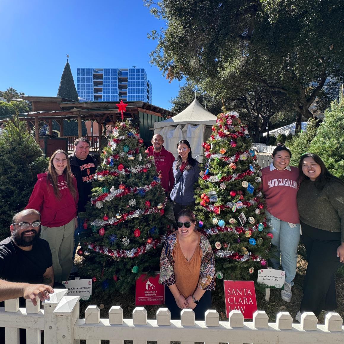 A group photo of School of Engineering and Law students and staff at Christmas in the Park