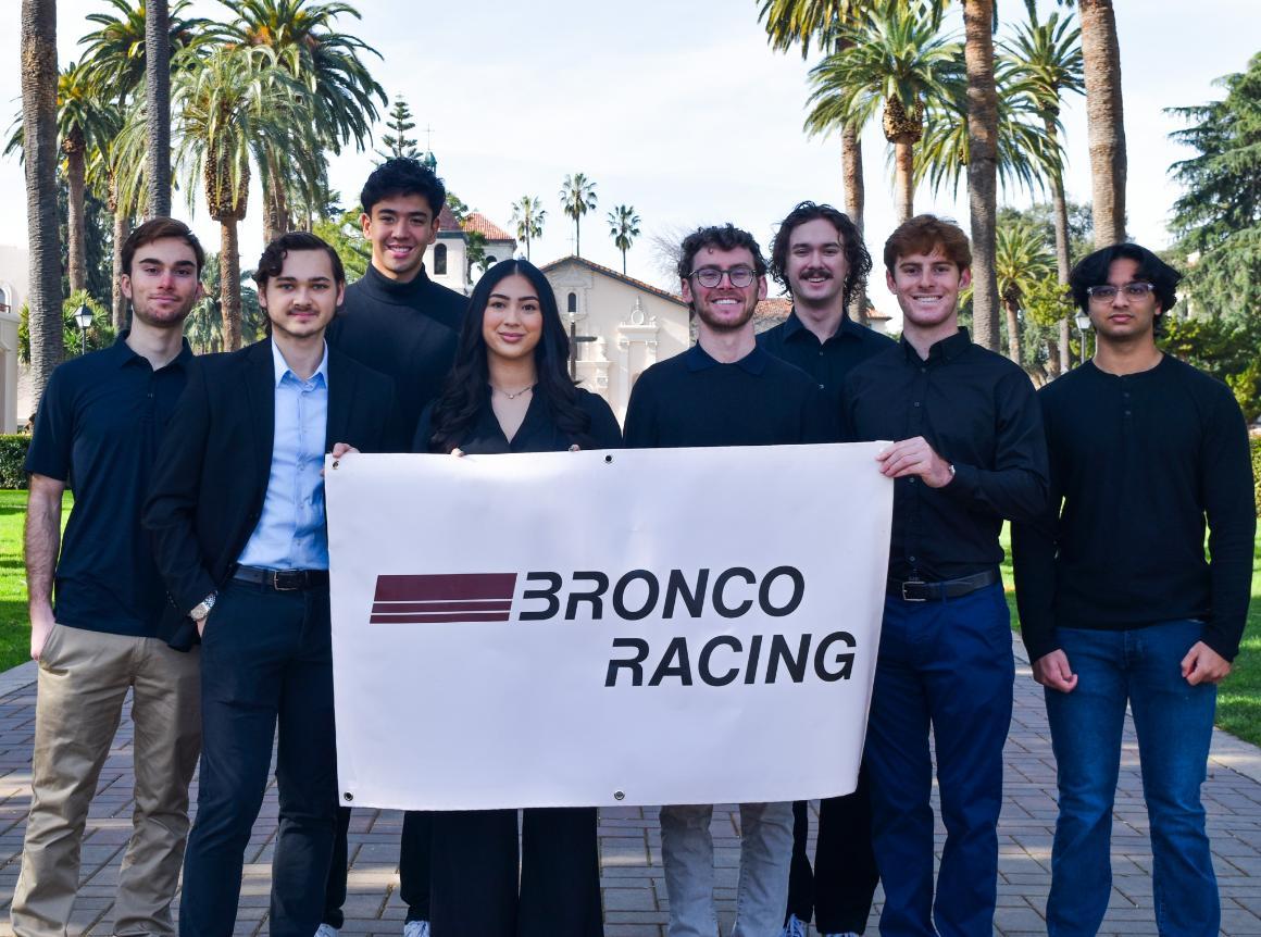 A picture of the Formula SAE Leads holding the Bronco Racing banner.