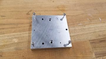 Custom jig made for mounting stock in PocketNC mill