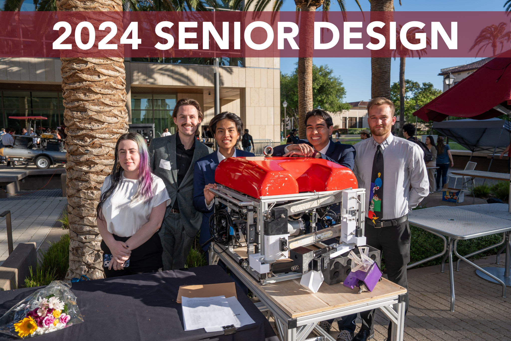 A group of seniors showcase their project in the SCDI courtyard. Title overlay reads 2023 Senior Design.