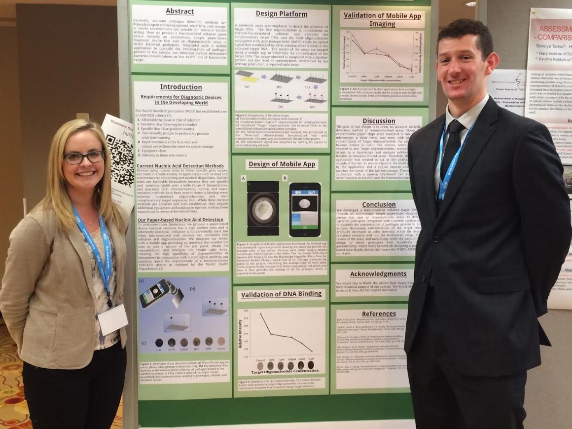 Students presenting their poster at a conference